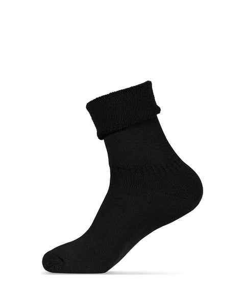 The menique women's merino lined sherpa socks in color black, in a white background, with the sock cuffed from a side view.