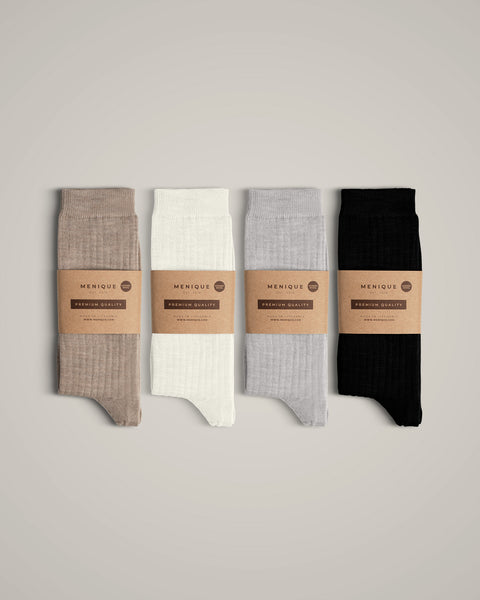 The menique women's merino wool ribbed crew socks in all available colors, with packaging.