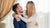 In the photo you can see couple hugging. They are both wearing long sleeve sweaters made from soft and organic 100% Merino Wool. Woman is wearing natural color crewneck, while man is wearing dark blue one,