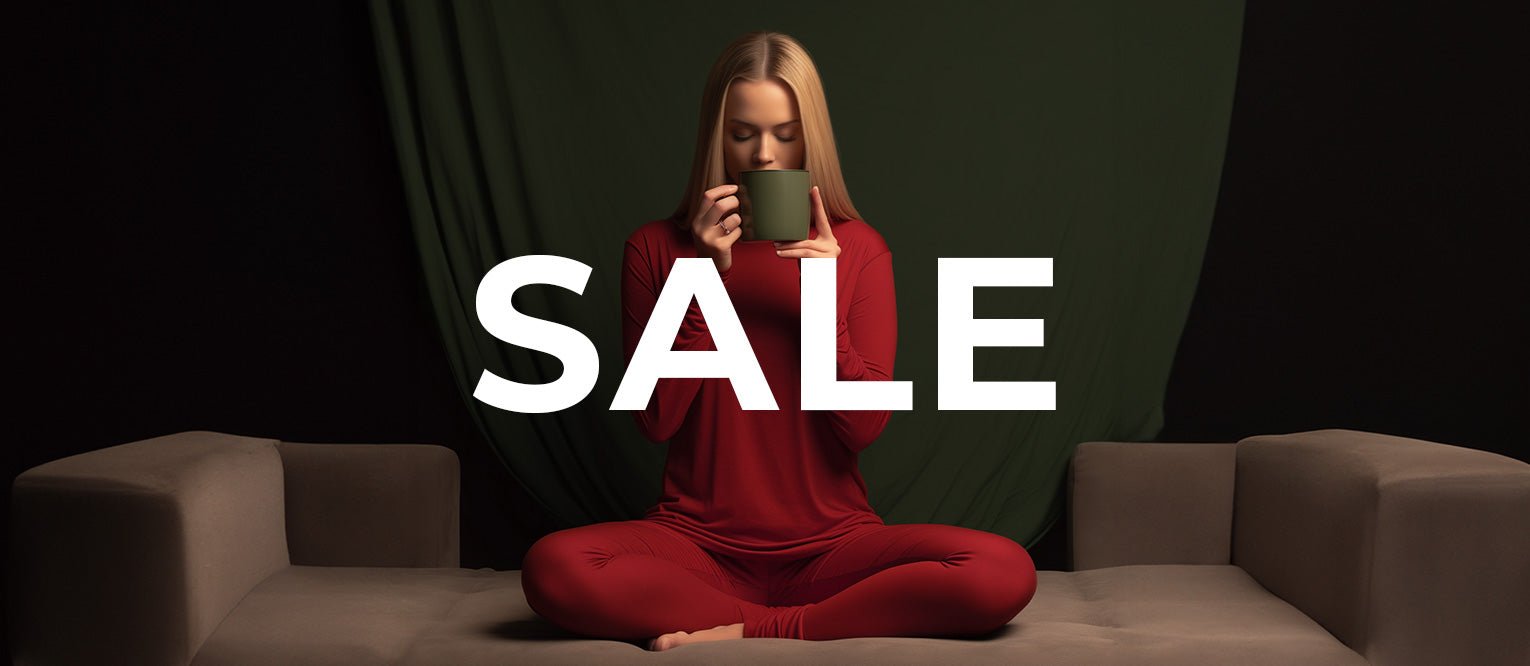 Made from Merino wool, menique clothes are hanging on a rack for sale.  