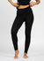 Person wearing black leggings on a white background