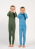 Two kids, a boy and a girl, wearing merino wool base layers, one in light blue and the other in dark green color. They are standing, making playful hand gestures on their face.