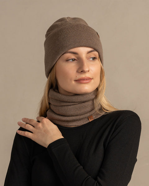 Women wearing knitted merino wool beanie and gaiter in brown color