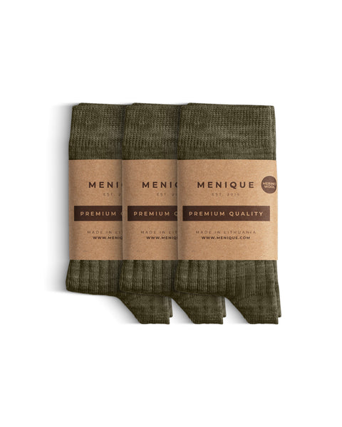 A 3-pack of kids’ green ribbed merino wool socks with “Menique Premium Quality” labels.