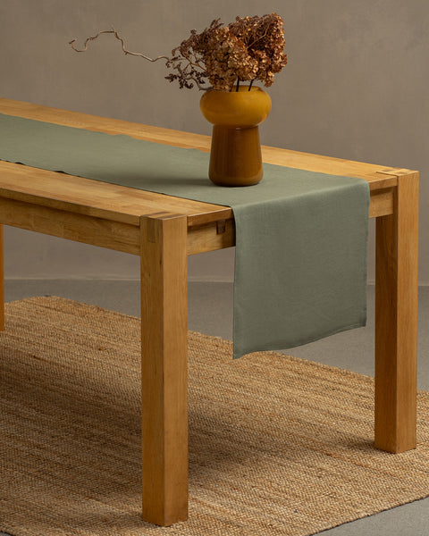 The menique stone green linen table runner. 