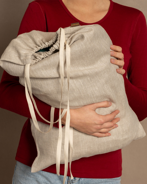 Linen laundry bag with white drawstrings