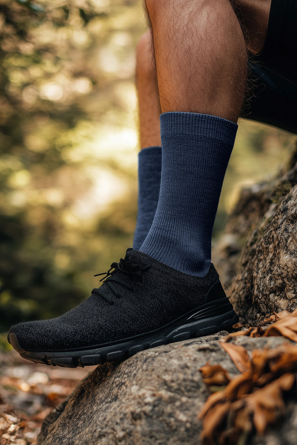 Men’s thin Merino wool crew socks in blue color, lightweight, odor-resistant, and soft for all-day wear.