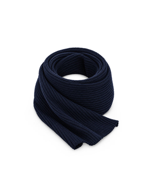 A navy blue ribbed knit scarf neatly rolled into a loose coil, displayed against a plain white background.