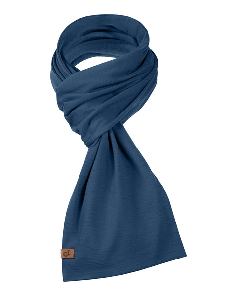 Unisex denim blue Merino wool scarf folded in a stylish knot, with small logo tag.