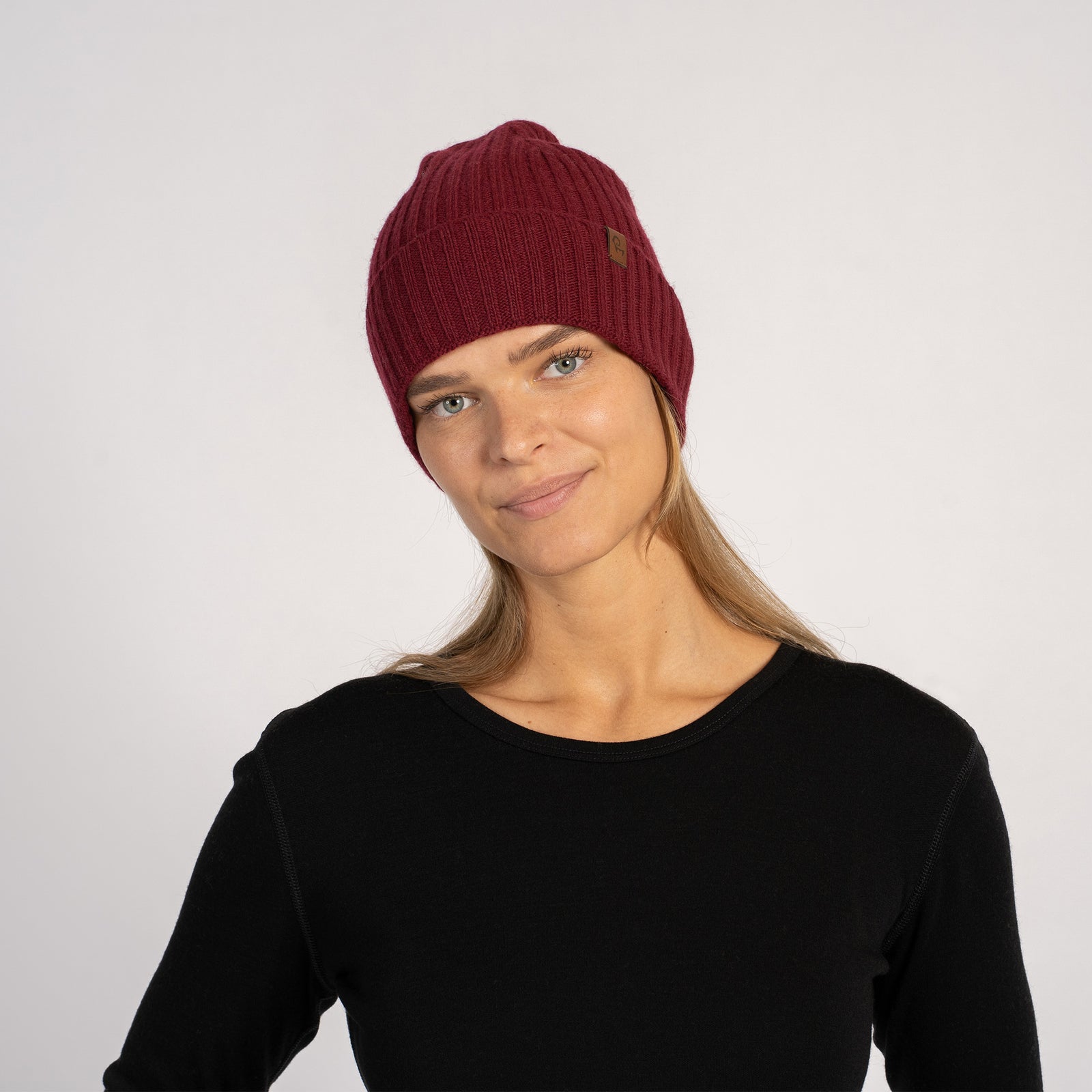 Women's Ribbed Beanie Knitted Merino in black color.