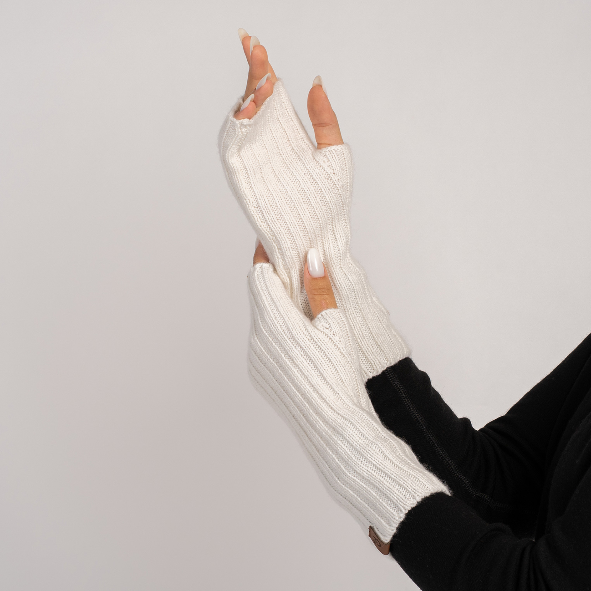 Close-up of royal cherry knitted wrist gloves – Merino & cashmere blend