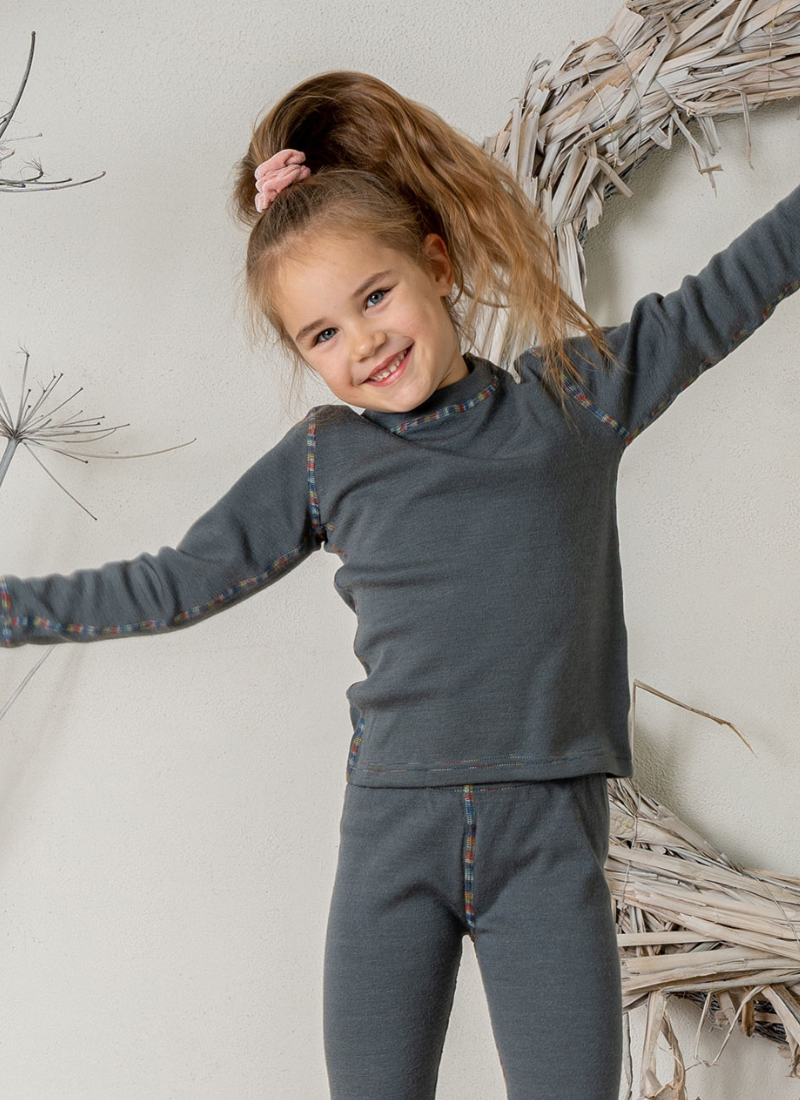 Little girl wearing Merino wool long sleeve top