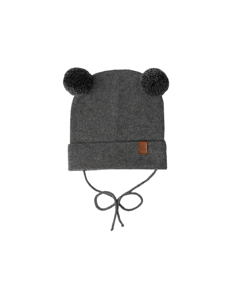 Dark gray baby beanie with pom-pom ears and chin ties on white background
