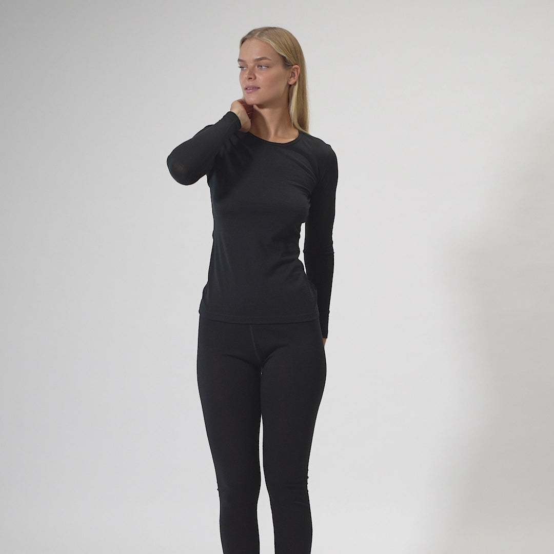 Video of woman, showing 100% Merino Wool black long sleeve shirt & leggings set