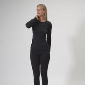 Video of woman, showing 100% Merino Wool black long sleeve shirt & leggings set